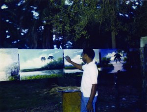 Al Black painting in backyard