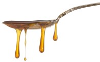 Sorghum Syrup Dripping From Spoon
