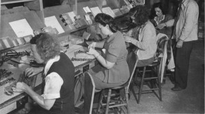 Women solder electronic parts